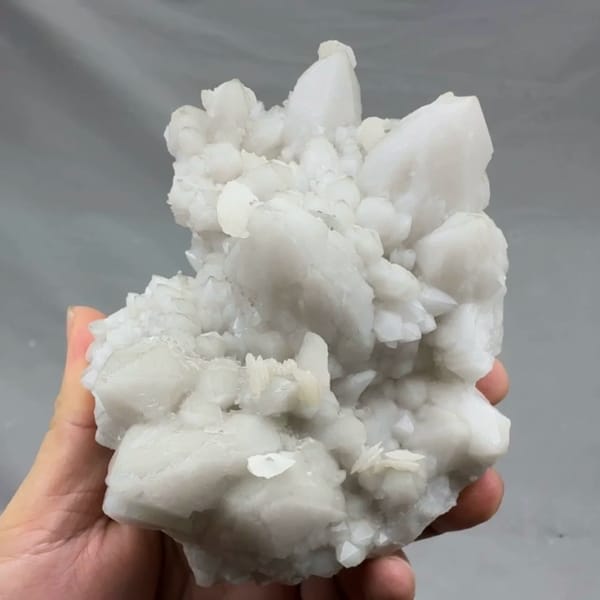 Chunky white quartz cluster with calcite from Xianghualing, Hunan, China, top view