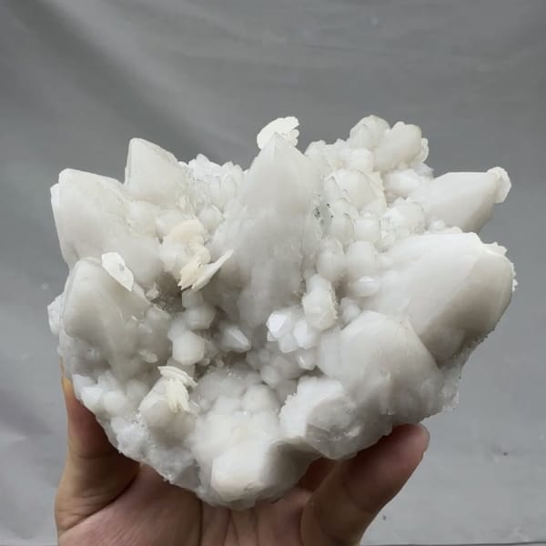 Chunky white quartz cluster with calcite from Xianghualing, Hunan, China, detail of the matrix contact
