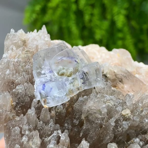 Pale blue combination-form fluorite crystals on quartz druse from Yunxiao, Fujian, China, second angle