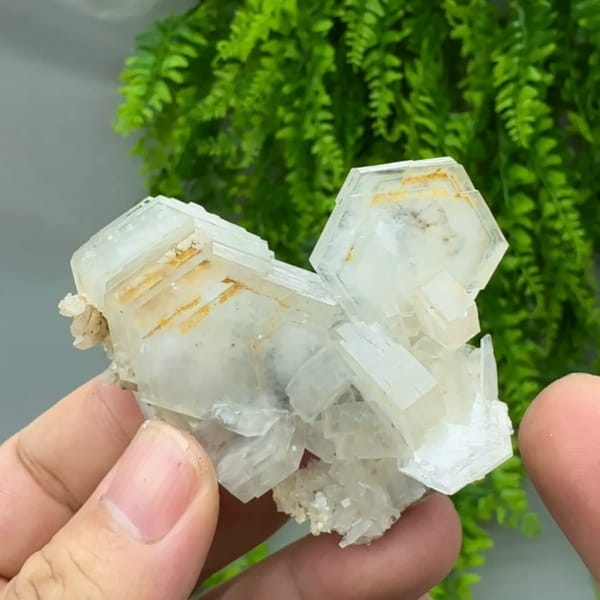 Stacked hexagonal calcite plates with orange growth lines from Fujian, China, reverse side