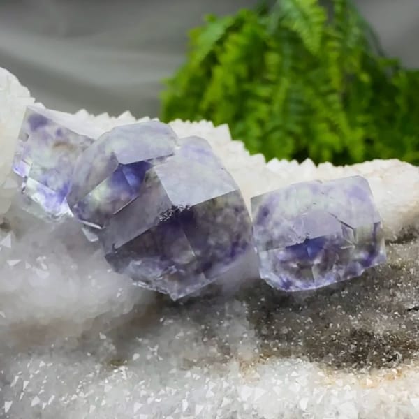 Deep purple dodecahedral fluorite on white quartz plate from Fujian, China, second angle