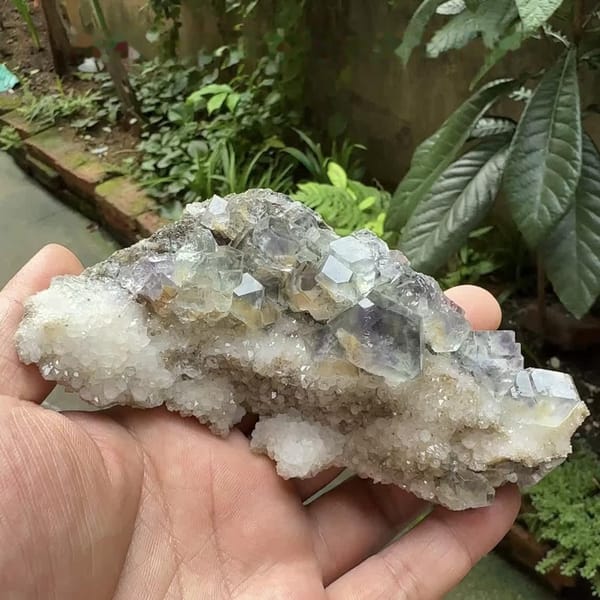 Pale blue-green fluorite dodecahedra on white quartz plate from Fujian, China, second angle