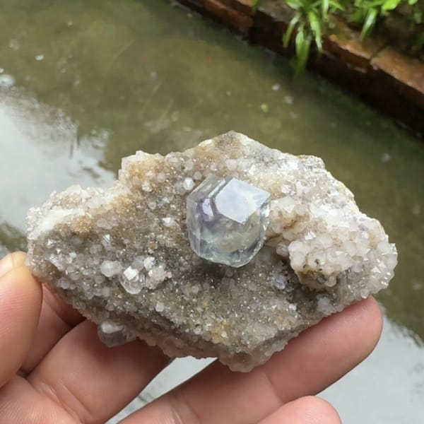 Pale blue fluorite dodecahedron on grey quartz plate from Fujian, China, second angle