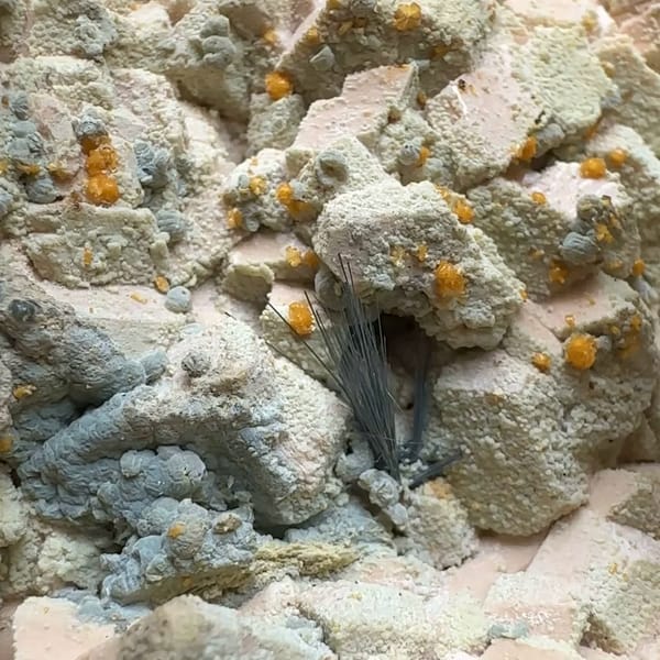 Tan feldspar towers with chabazite and bismuthinite from Yunxiao, Fujian, China, second angle