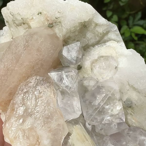 White fluorite octahedra with calcite prism and quartz from Inner Mongolia, China, reverse side