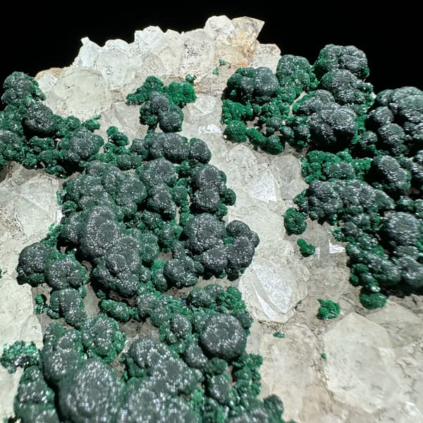 Green malachite islands on white quartz plate from Laos, reverse side