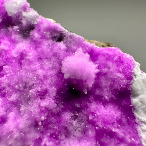 Vivid magenta aragonite with white aragonite tufts from Yunnan, China, reverse side