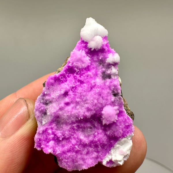 Vivid magenta aragonite with white aragonite tufts from Yunnan, China, top view