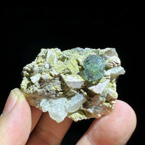 Green fluorite octahedron on yellow-green mica and feldspar from Yunxiao, Fujian, China