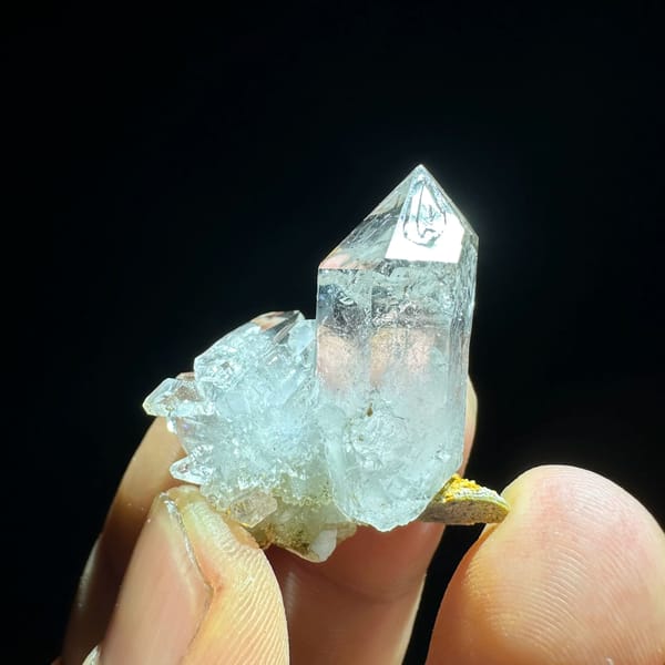 Water-clear window-faced diamond quartz crystal from Sichuan, China, close-up of the crystal faces