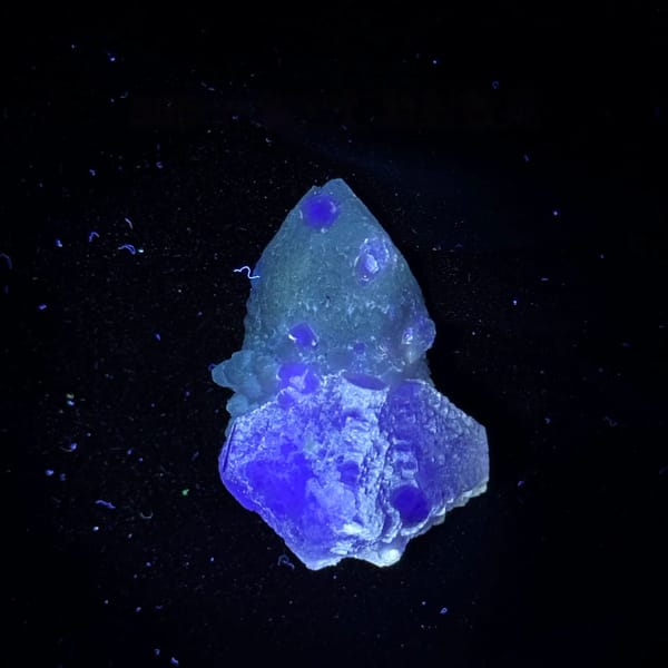 Pale blue-green fluorite enclosing candle quartz from Inner Mongolia, China, second angle