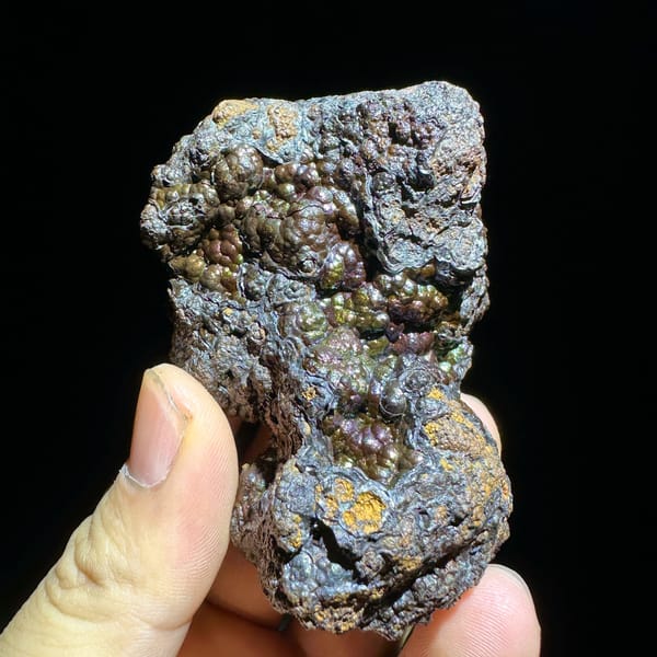 Iridescent multicoloured botryoidal limonite from Guizhou, China, reverse side