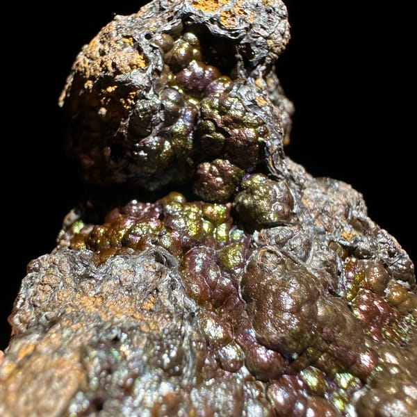Iridescent multicoloured botryoidal limonite from Guizhou, China, top view