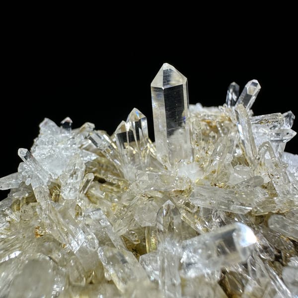 Dense cluster of transparent quartz needles from Hunan, China, reverse side