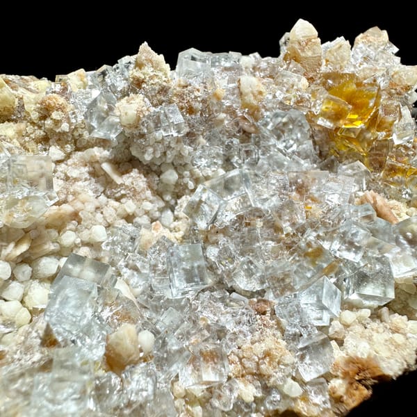 Ice-clear fluorite cubes on quartz plate from Guizhou, China, reverse side