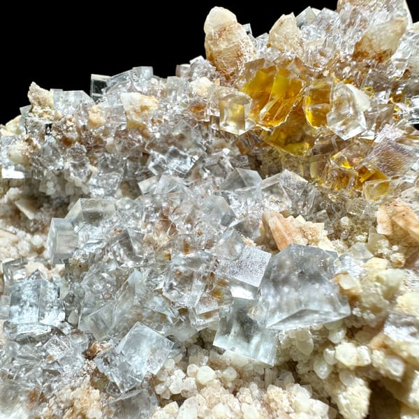Ice-clear fluorite cubes on quartz plate from Guizhou, China, top view