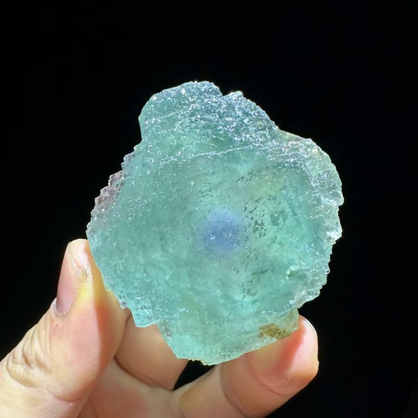 Large sea-green fluorite crystal with purple core from Guangxi, China, second angle