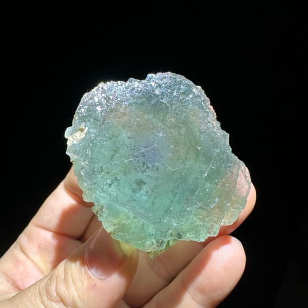 Large sea-green fluorite crystal with purple core from Guangxi, China, reverse side