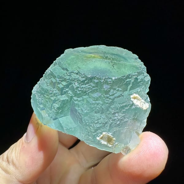 Large sea-green fluorite crystal with purple core from Guangxi, China, top view