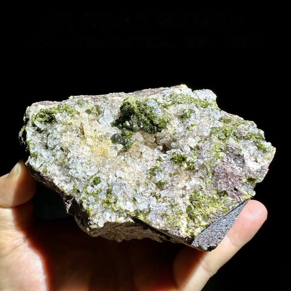 Sparkling quartz with green botryoidal epidote balls from Yunnan, China, detail of the matrix contact