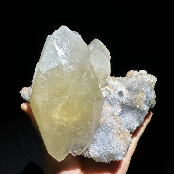 Huge golden calcite crystal on white quartz druse from Fujian, China, reverse side