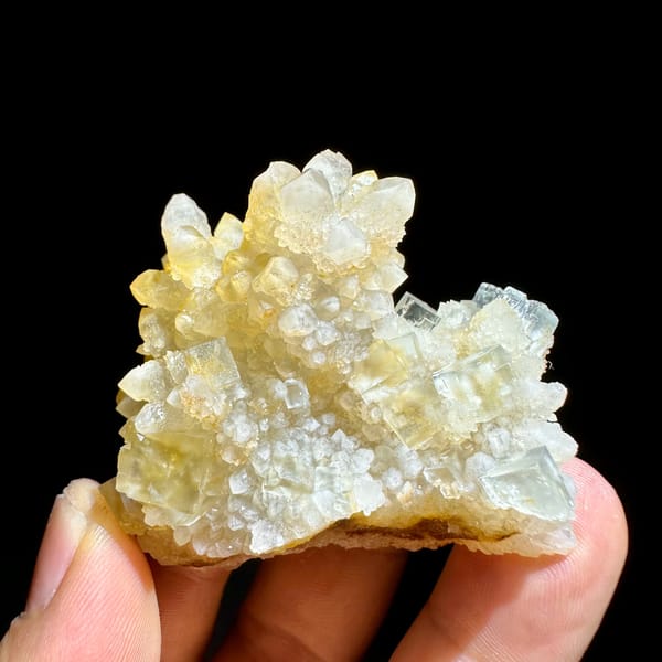 Ice-clear fluorite cubes on golden quartz cluster from Guizhou, China, reverse side
