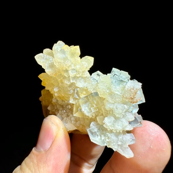 Ice-clear fluorite cubes on golden quartz cluster from Guizhou, China, top view