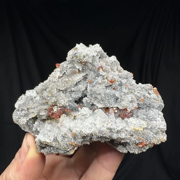 Red gem sphalerite crystals on grey calcite and quartz from Hunan, China, detail of the matrix contact