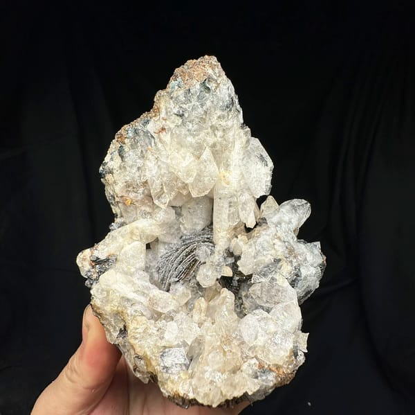 Tower of sugar-textured white quartz with black specular hematite from Guangdong, China