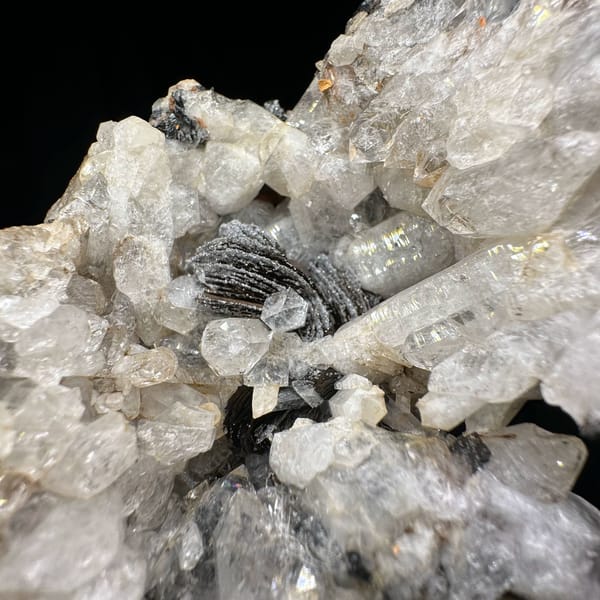 Tower of sugar-textured white quartz with black specular hematite from Guangdong, China, reverse side