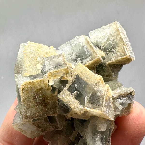 Etched cream fluorite cubes with sugary skin from Fujian, China, reverse side