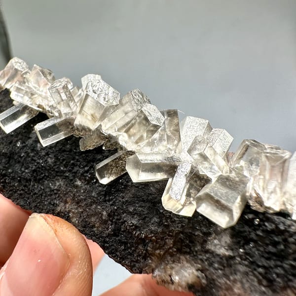 Translucent aurora calcite crystals on dark matrix from Fujian, China, second angle