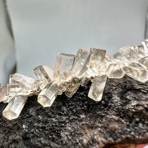 Translucent aurora calcite crystals on dark matrix from Fujian, China, reverse side