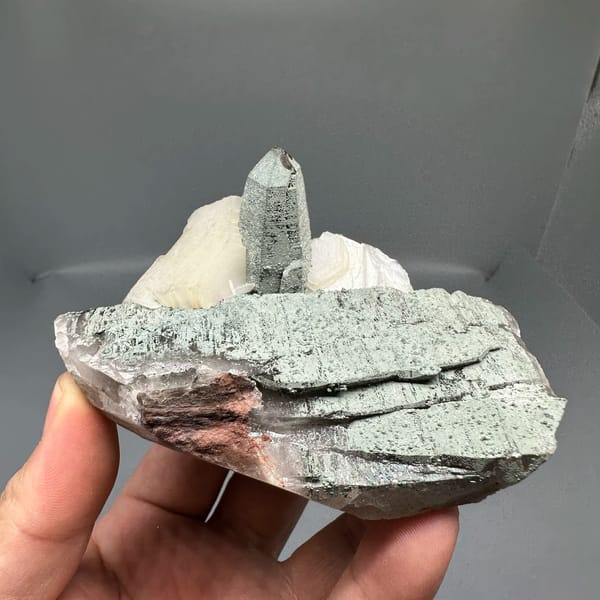 Clear quartz point on green chlorite block with calcite from Yunxiao, Fujian, China