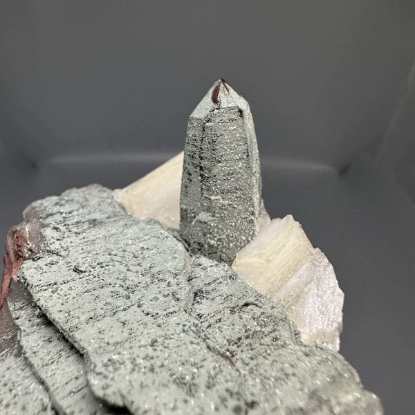 Clear quartz point on green chlorite block with calcite from Yunxiao, Fujian, China, reverse side