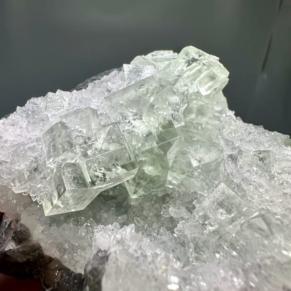 Glassy green fluorite under white quartz frosting from Zhejiang, China, top view