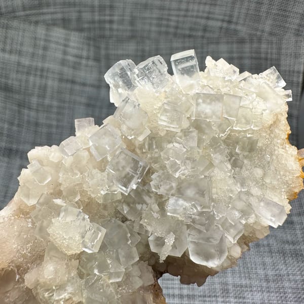 Colourless fluorite cubes on quartz plate from Guizhou, China, reverse side