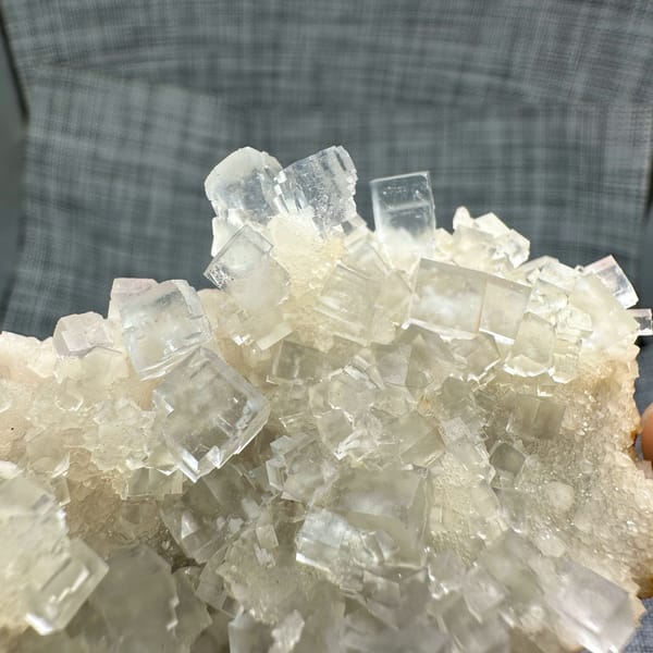 Colourless fluorite cubes on quartz plate from Guizhou, China, top view