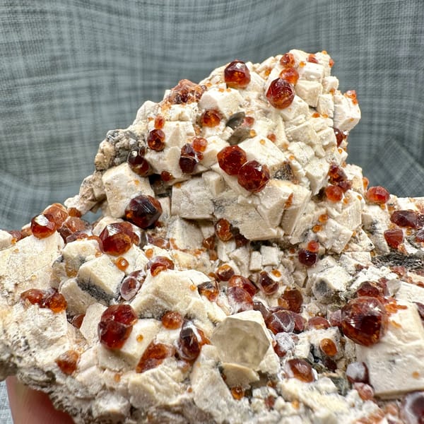 Feldspar plate peppered with wine-red garnets from Yunxiao, Fujian, China, second angle
