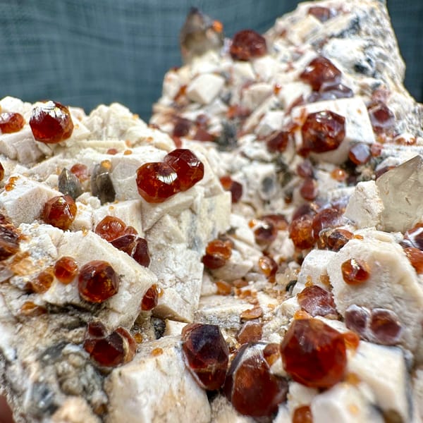 Feldspar plate peppered with wine-red garnets from Yunxiao, Fujian, China, reverse side