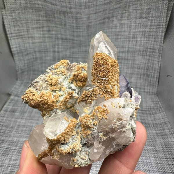 Clear quartz spire with purple fluorite, dolomite and mica from Yaogangxian Mine, Hunan, China