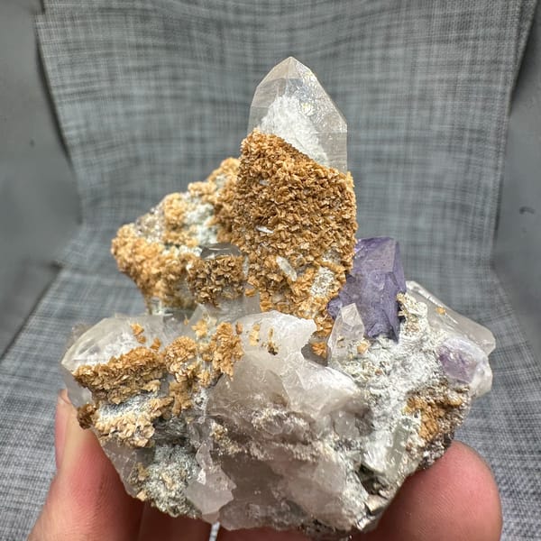 Clear quartz spire with purple fluorite, dolomite and mica from Yaogangxian Mine, Hunan, China, second angle