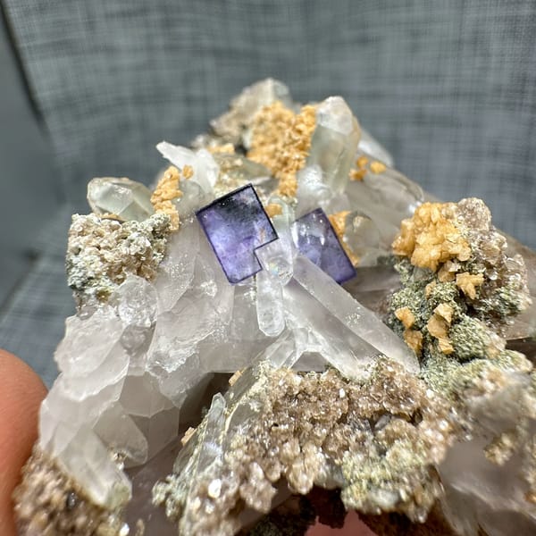 Clear quartz spire with purple fluorite, dolomite and mica from Yaogangxian Mine, Hunan, China, reverse side