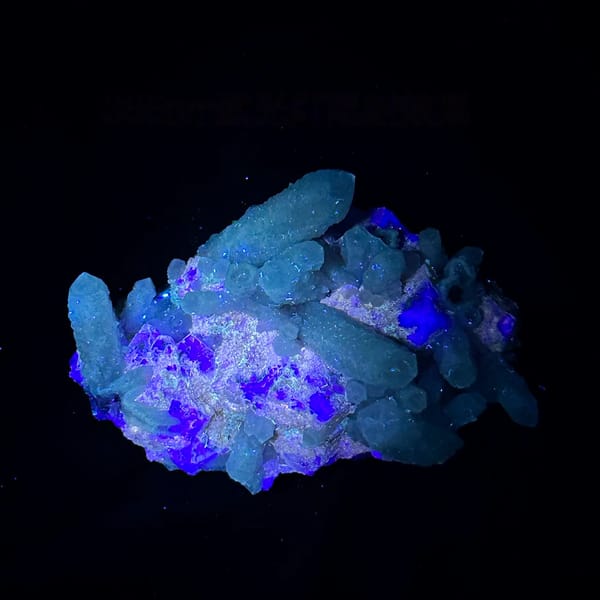 White candle quartz prisms with purple fluorite octahedron from Inner Mongolia, China, second angle