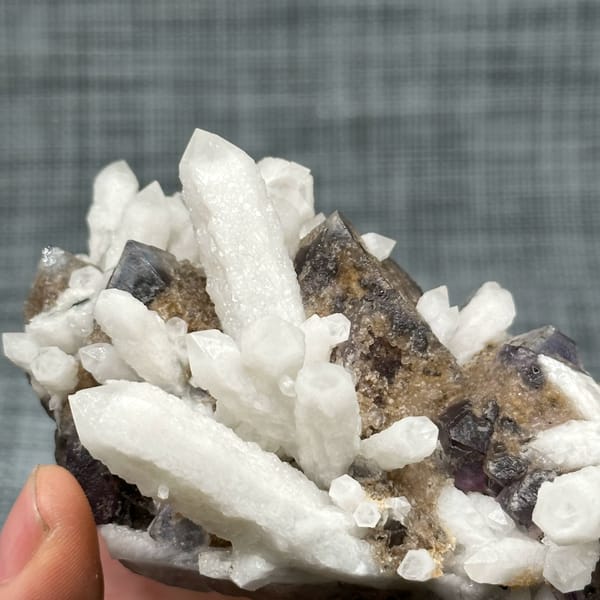White candle quartz prisms with purple fluorite octahedron from Inner Mongolia, China, top view