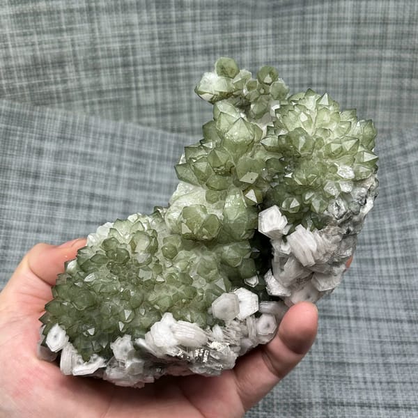 Plate of green chlorite quartz with white hexagonal calcite from Fujian, China, top view