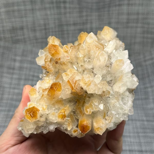Mango-yellow quartz crystals with white hexagonal calcite from Fujian, China, close-up of the crystal faces