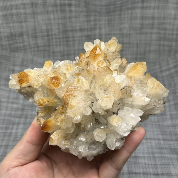 Mango-yellow quartz crystals with white hexagonal calcite from Fujian, China, detail of the matrix contact