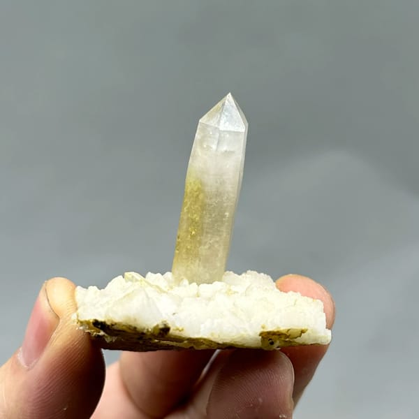 Gradient quartz point standing on white feldspar from Yunxiao, Fujian, China, second angle