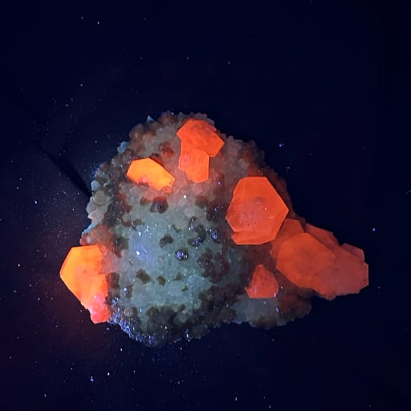 Pale pink calcite with tan dolomite crusts from Jiangxi, China, second angle